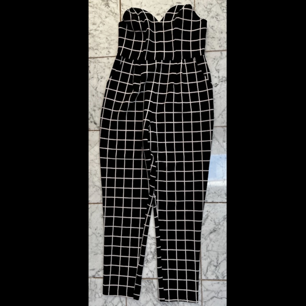 BooHoo strapless jumpsuit black and white windowpane pattern.